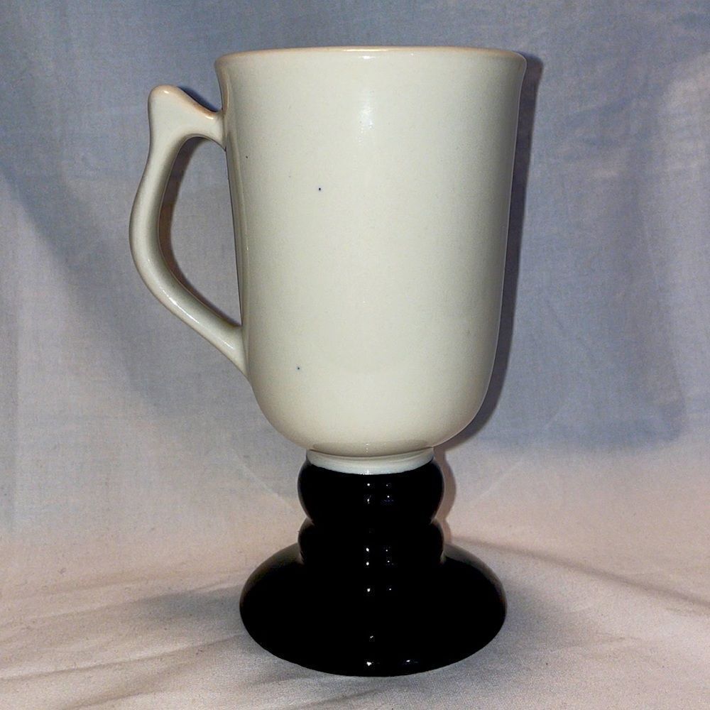Ceramic mug, 6 inches tall, made I. The USA , in great condition.